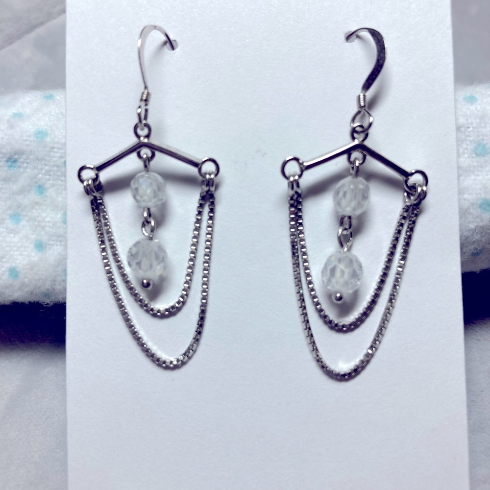 Silver dangling earring.  New without tags.